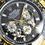✨**BLAKEN UPGRADE ALERT!**✨n第六代迪通拿碳黑复刻版 镂空设计！6th Gen Daytona Carbon Black Replica，40mm上手绝了！n🔥核心亮点一眼种草：n▪️12.2mm超薄机身 12.2mm Ultra-thin Case（甩开市面13.5mm普通款），全实心精钢 Solid Stainless Steel 打造，接缝几乎0缝隙，质感拉满！n▪️哑黑套件 Matte Black Kit 升级+多色圈口 Multi-color Bezels 可选，后期想换风格随便搭，个性党狂喜～n▪️表带双选项：硅胶款 Silicone Strap 轻便舒适/精钢款 Steel Strap 硬朗有范儿，CNC全程精雕 CNC Precision Engraving + 人工打磨，细节控直接爱住！n⌚机芯硬核：n4802一体机芯 4802 Integrated Movement，搭载72-hour Long Power Reserve长储能，计时功能 Chronograph Function 和专柜同步，走时稳得一批～n💡贴心设计：n蚝式保险扣 Oyster Safety Clasp 防意外打开，实心链结 Solid Links 戴久了也舒服，操作还特简单！n低调又有面儿，这波升级真的可！n